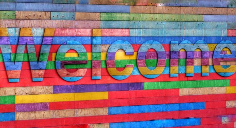 Colorfully painte sign that says welcome depicting Diag Partners welcoming Samantha Ziarko as managing partner