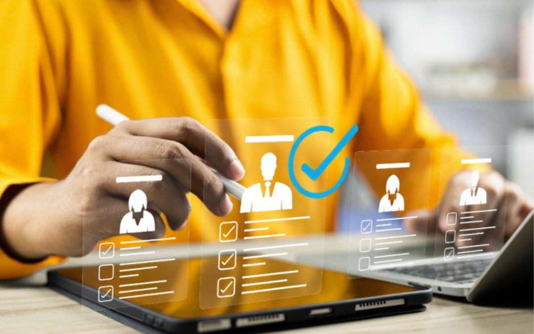 Professional reviewing candidates on tablet